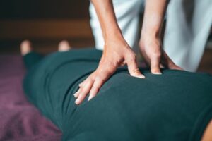 a therapist applying deep pressure during a massage